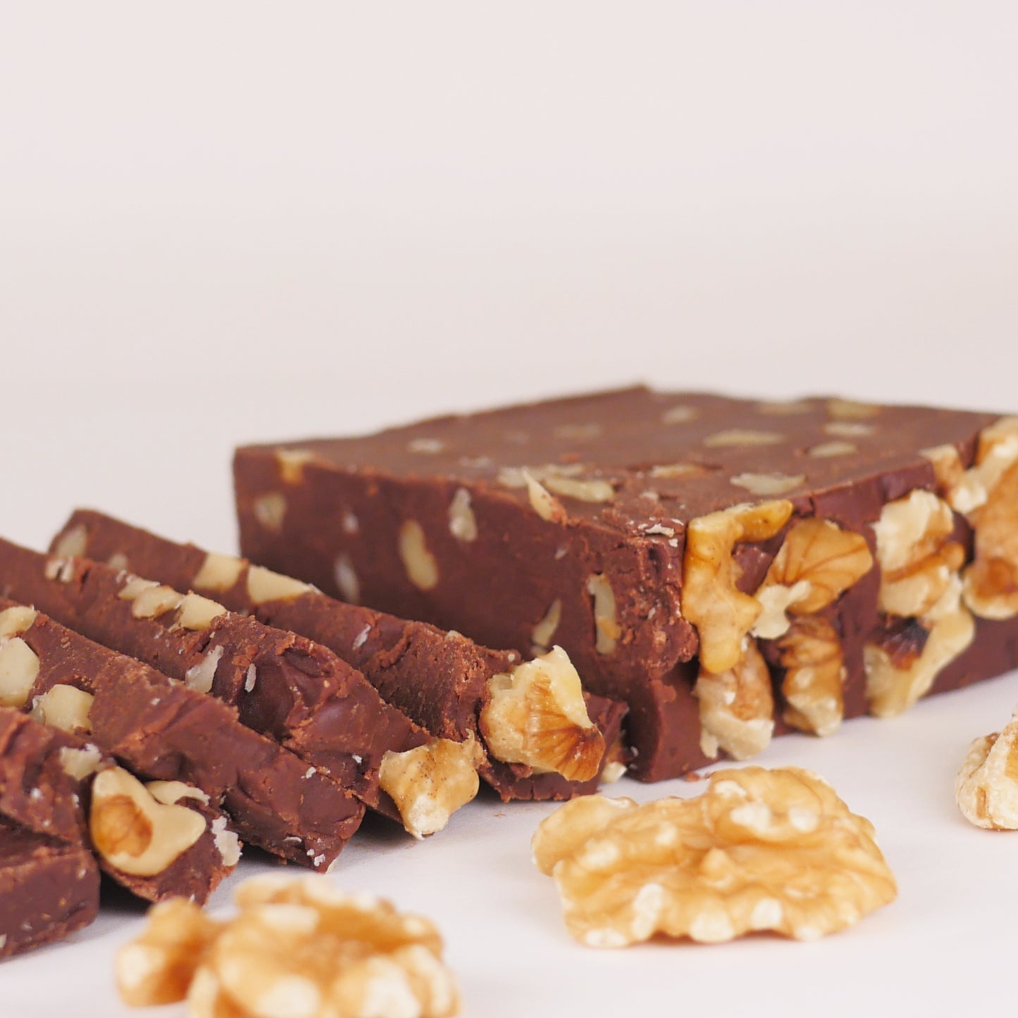 Slice of Color Me Flavors classic chocolate walnut fudge with whole walnuts