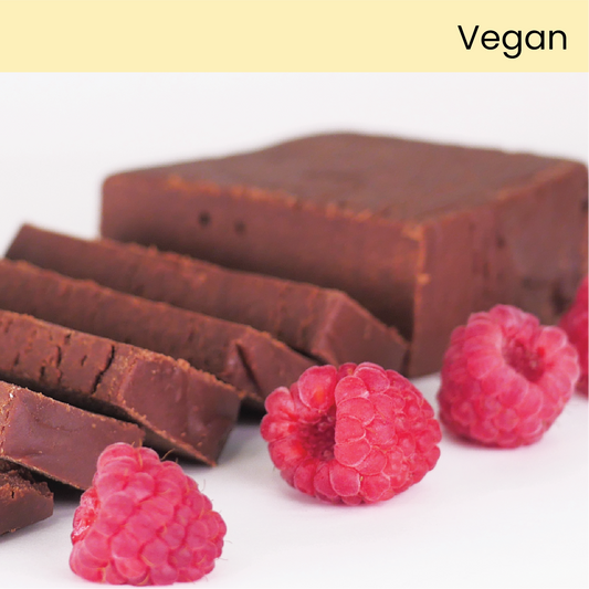 Slice of Color Me Flavors vegan chocolate raspberry fudge with whole raspberries